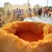 A giant bag of orange colored powder is ready for volunteers to throw over participants in the Ypsilanti Color Run 5K on Sunday morning. Melanie Maxwell I AnnArbor.com
